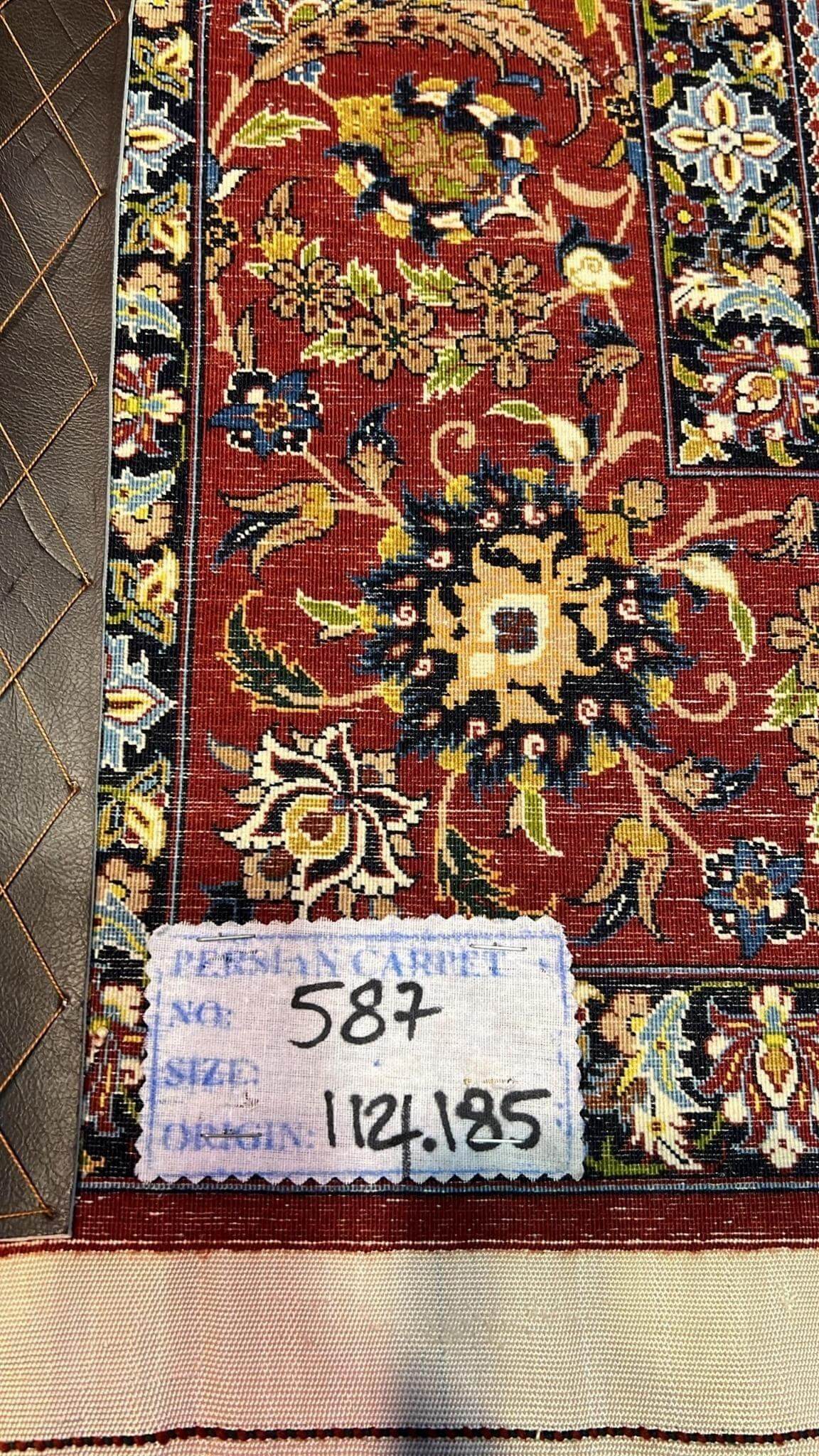 "Backside of a Seirafian hand-knotted rug, highlighting the fine knotting and silk warp, ensuring durability and authenticity."
